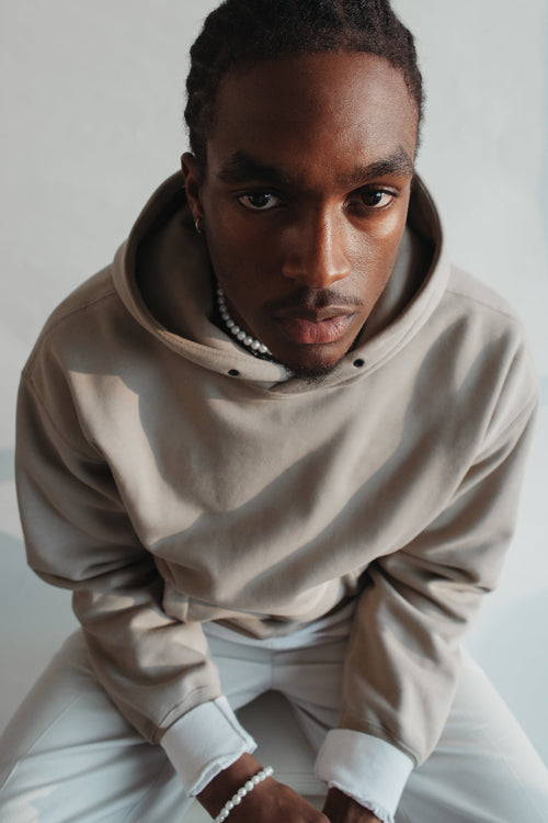 The Surrender Hoodie in Oat, worn