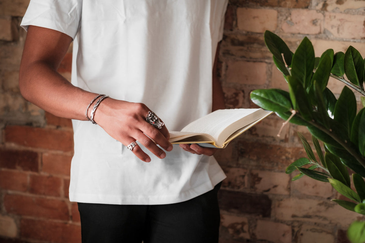 The Word Tee in White, worn while reading